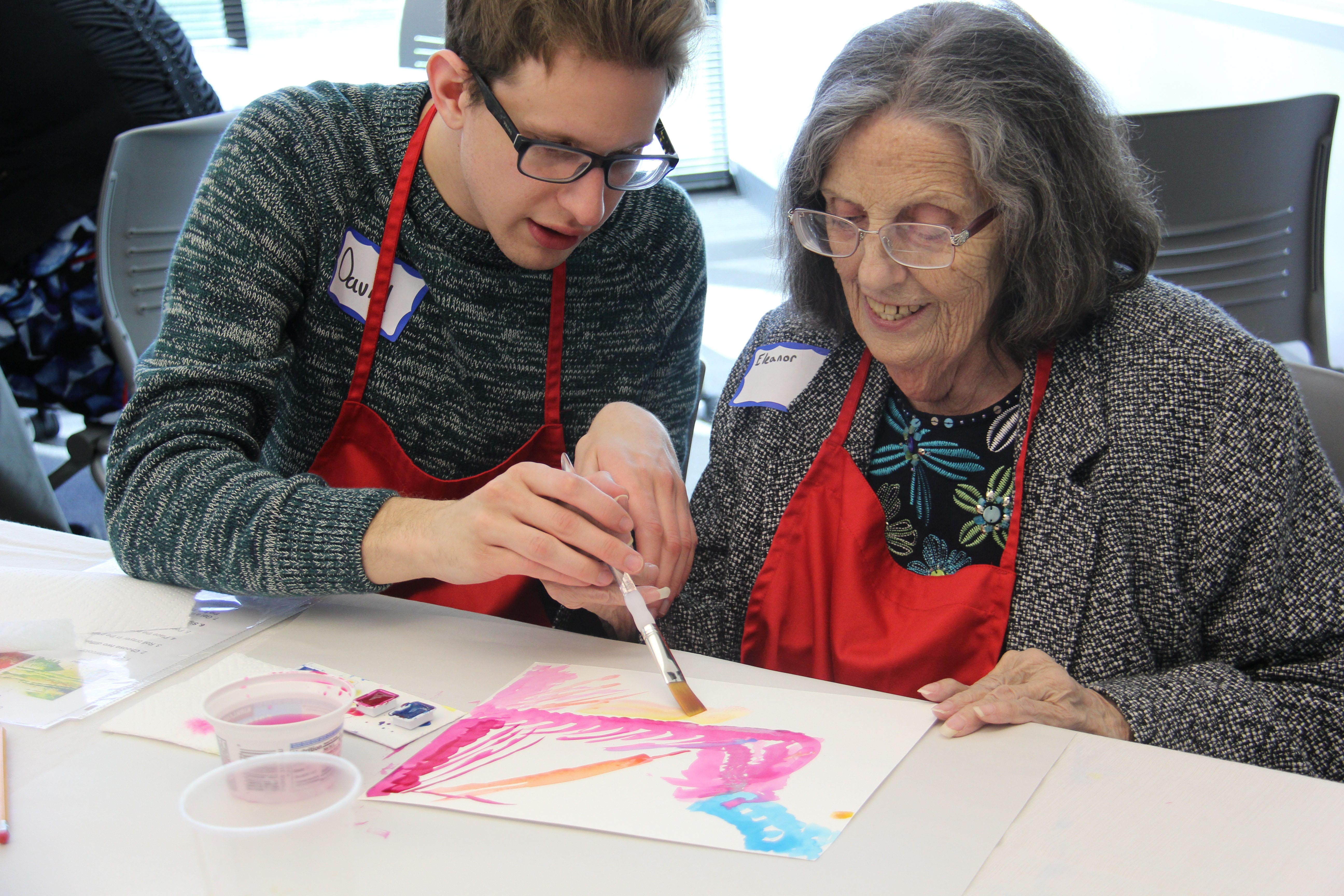 occupational therapy student helping patient with an art project
