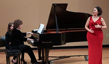 The Music At Maryville concert series was founded in 1980 by Katja Georgieff, then director of Maryville University’s music program. Performers singing and playing instruments at a Music at Maryville Concert