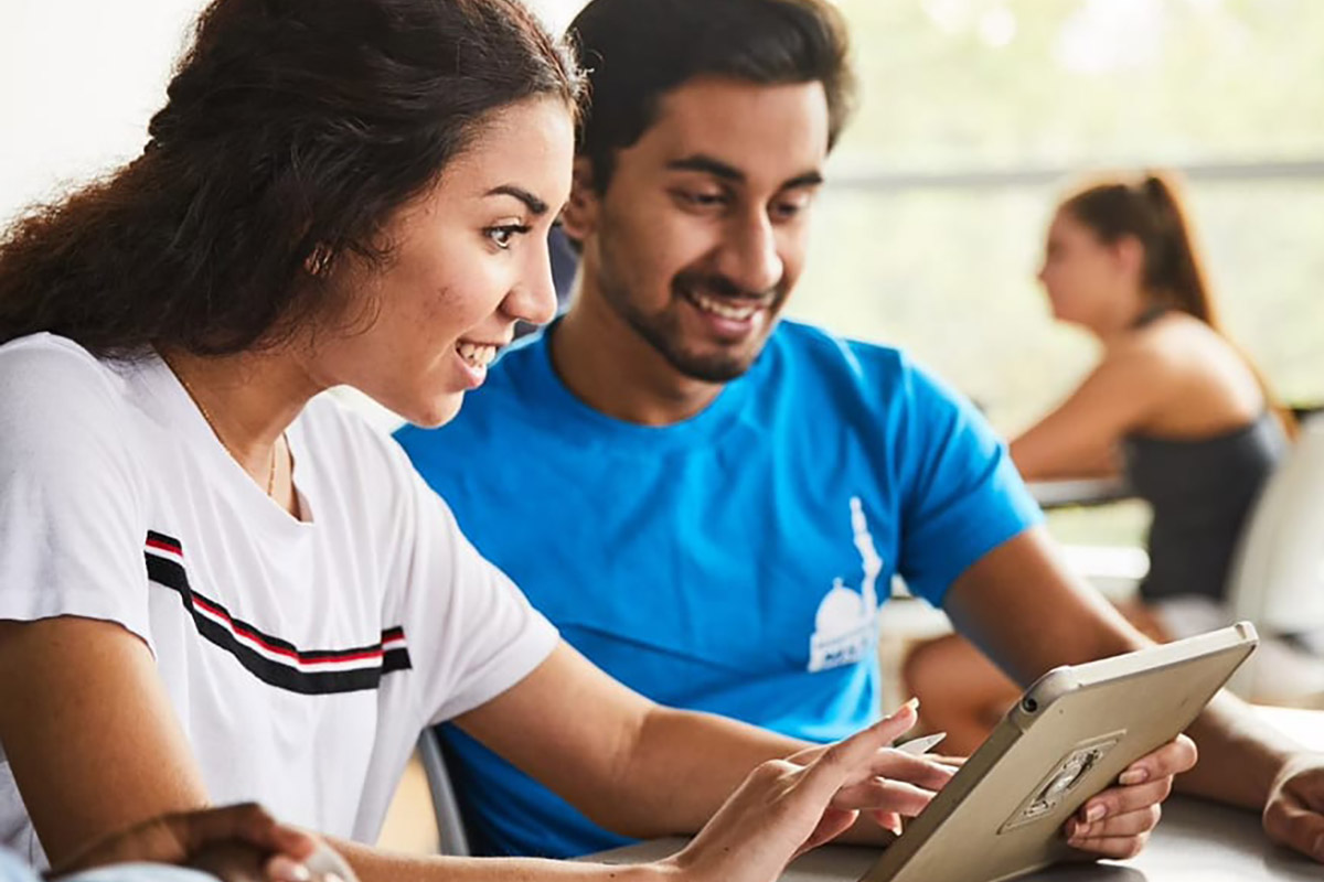 student looking over an ipad