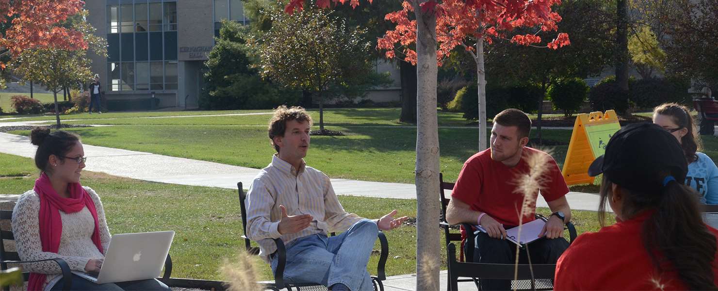 Faculty teaching students outside classroom