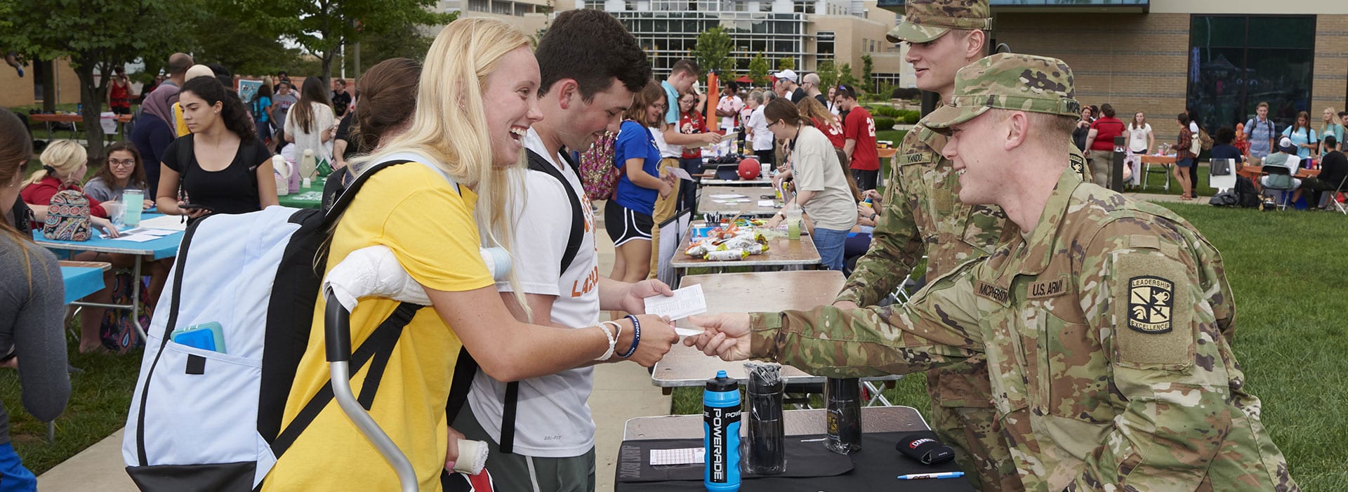 students interacting with recruiters during career fair