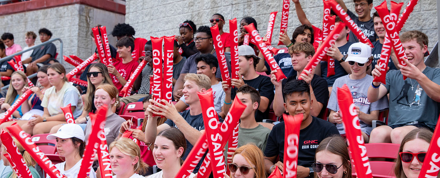 Students cheering at soccer game