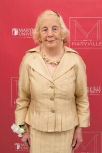 Janet McMahon standing in front of a Maryville background