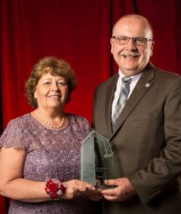 Christine Crain receiving Maryville Spirit award from Chuck Gulas