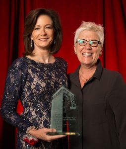 Kay Quinn receiving Maryville Spirit award from Cheri Fister