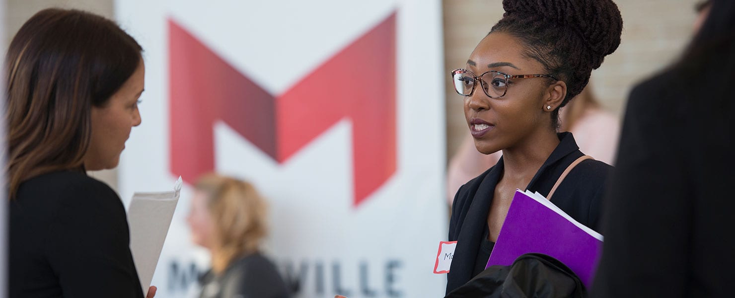 maryville alum receiving career guidance before career fair