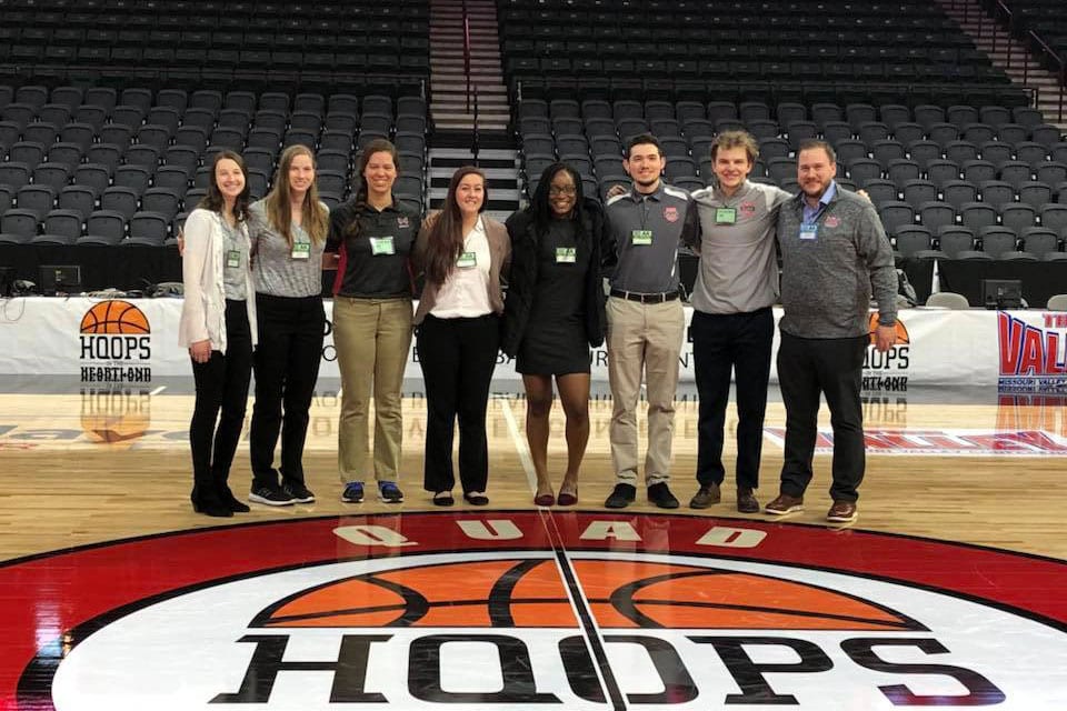 Maryville University Rawlings Sport Management degree students working a the MVC basketball championships