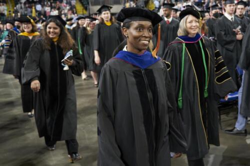 students walking to seats during commencement