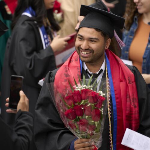 graduate smiling while having picture taken