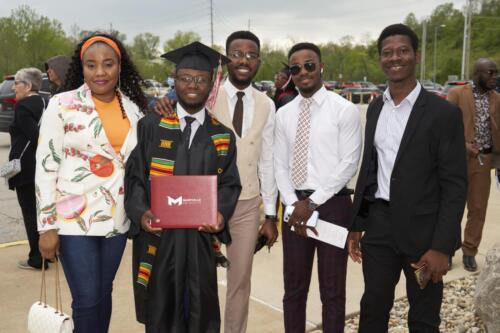 graduate getting a pic with friends and family