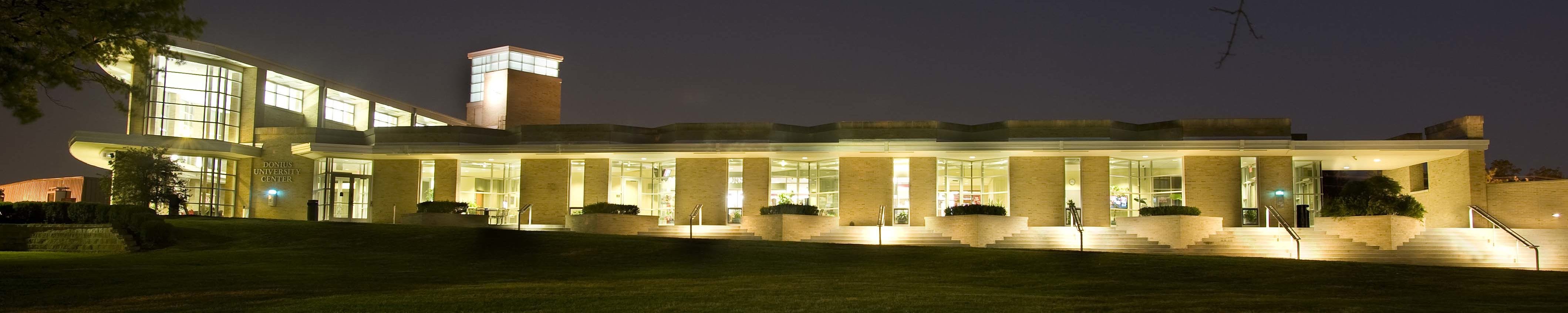 Donius University Center lit up at night