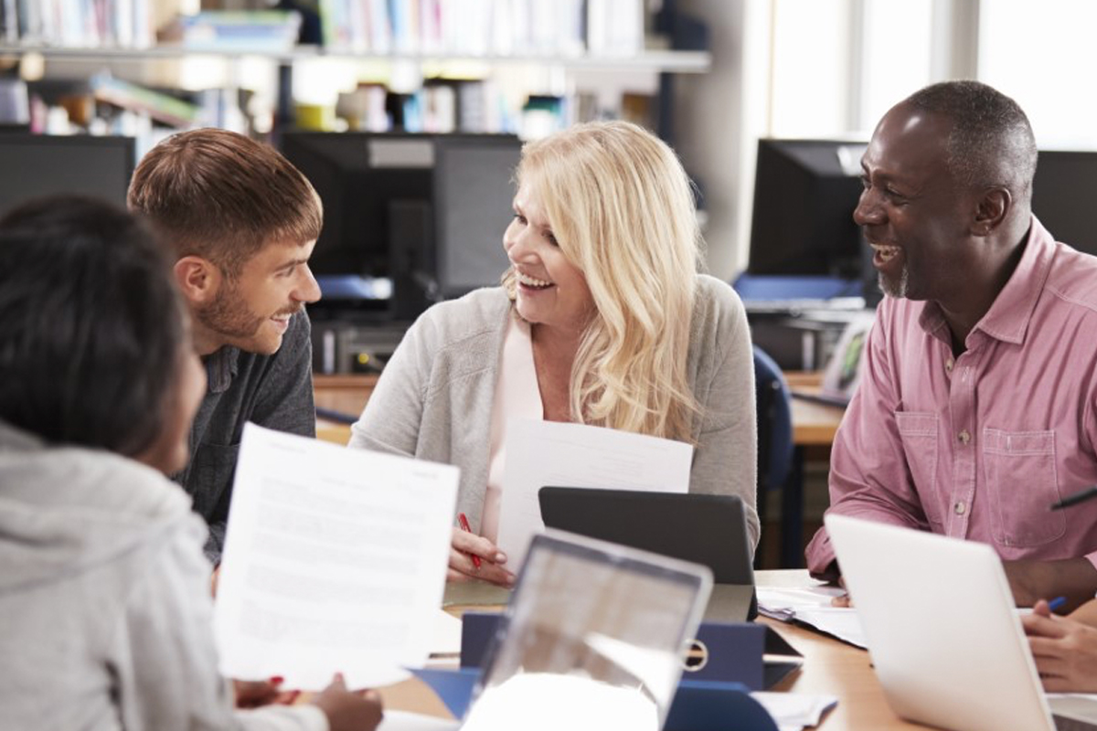 students discussing work