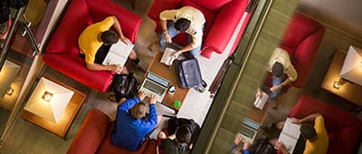 students collaborate in work space