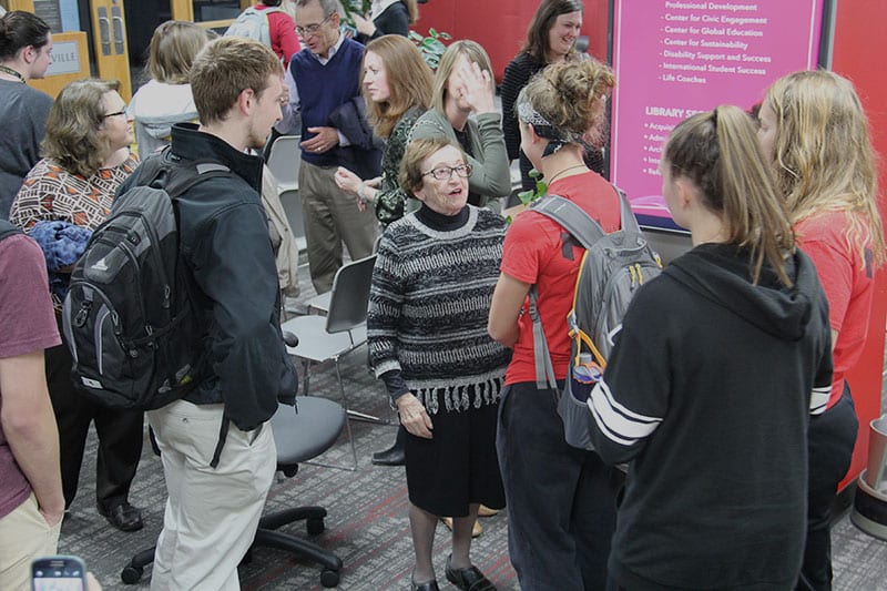 students talking to guest speaker