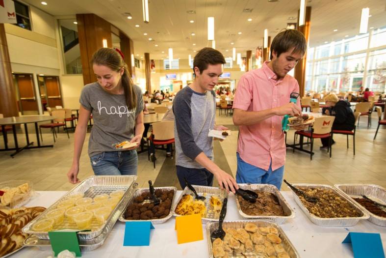 Students take a break to eat during Maccabi games