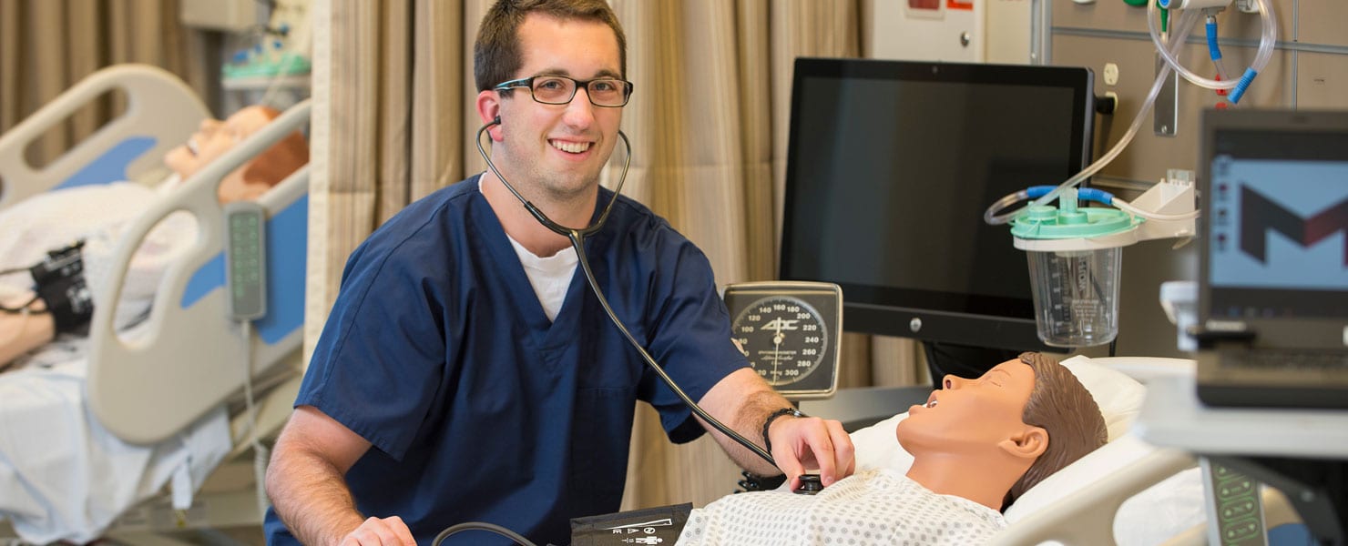 nursing student learning in nursing simulation lab