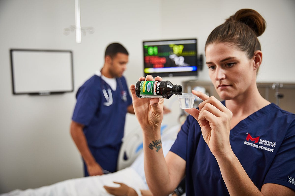 healthcare management students in nursing lab