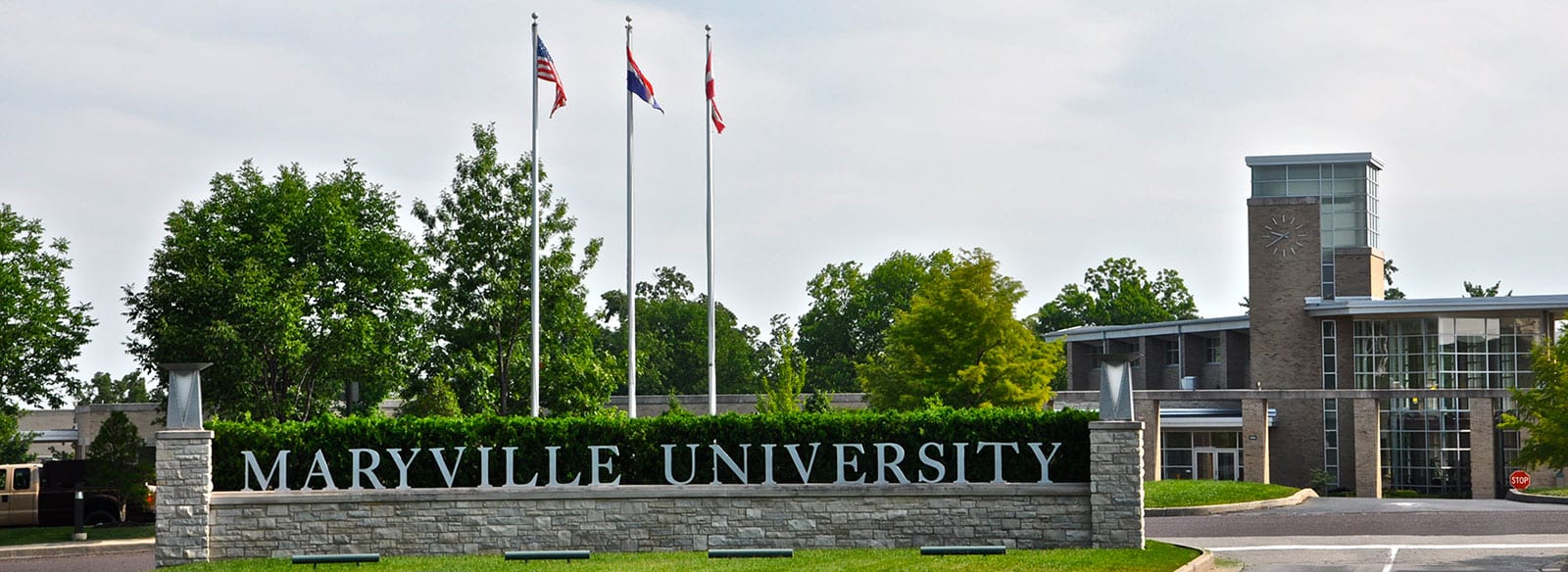 Photo of flags in front of Maryville sign