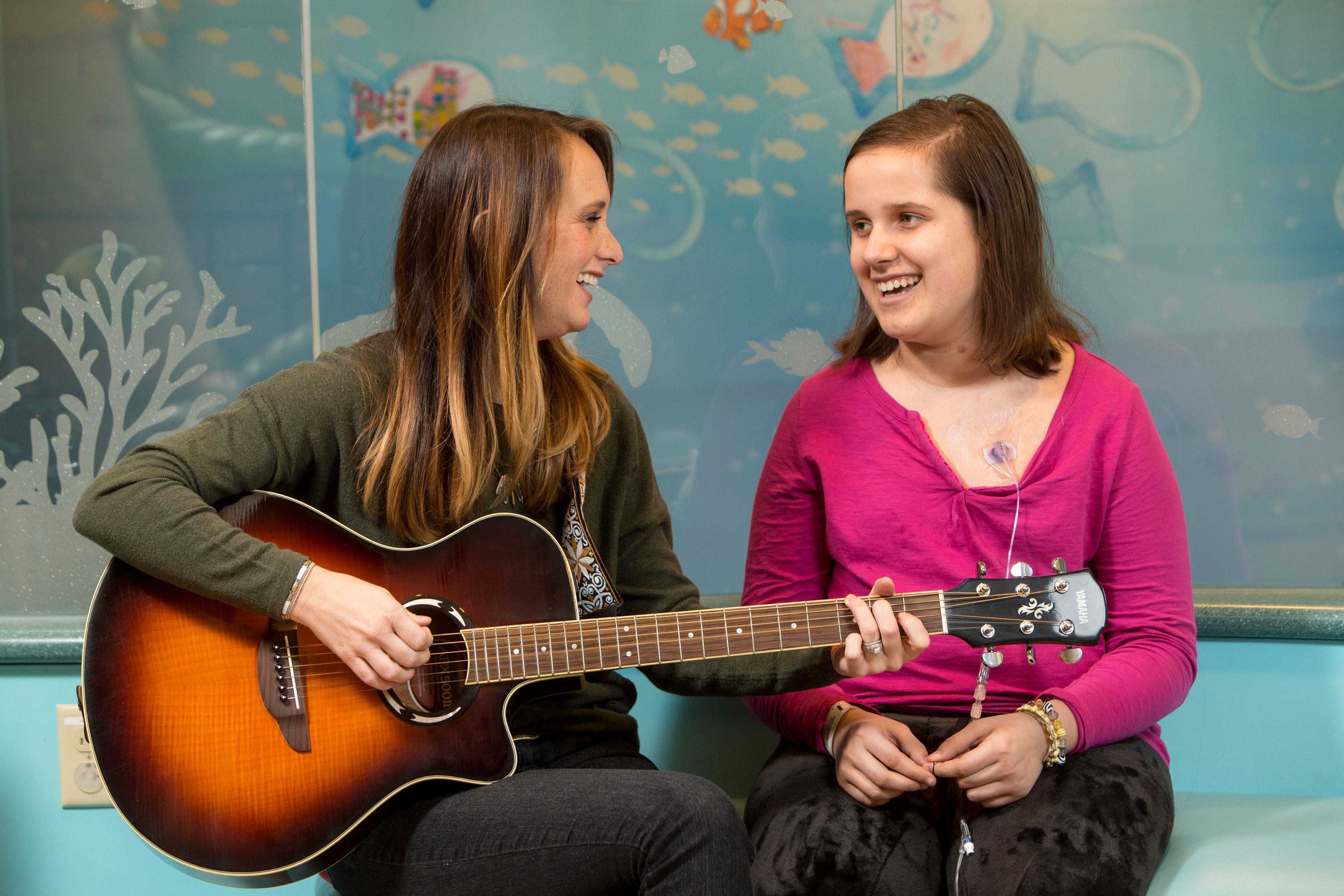 Maryville University music therapy student working with a patient