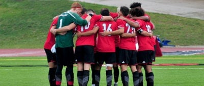 soccer team in a huddle