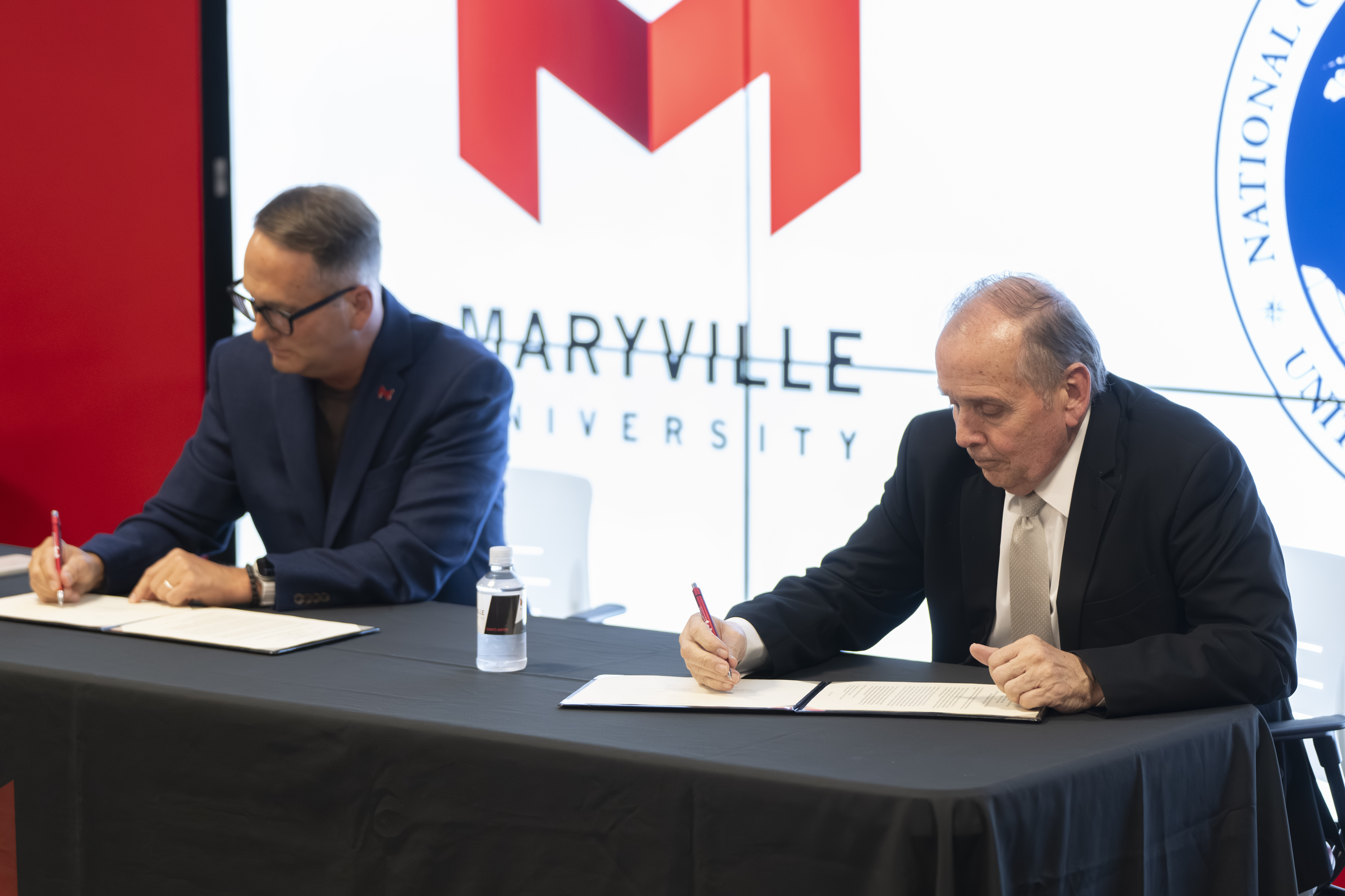 Maryville University President Dan Shipp and NGA West Executive and Director, Office of Corporate Communications William Caniano