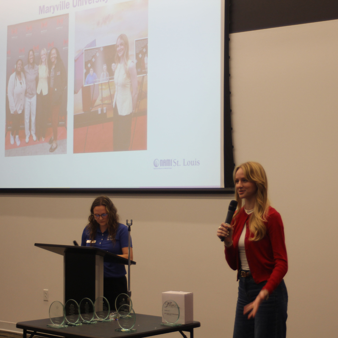 Cadie Buschjost accepts award on behalf of Maryville University for NAMI Chapter of the Year
