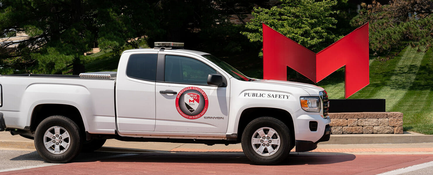 Public safety truck sitting in front of the Red M.