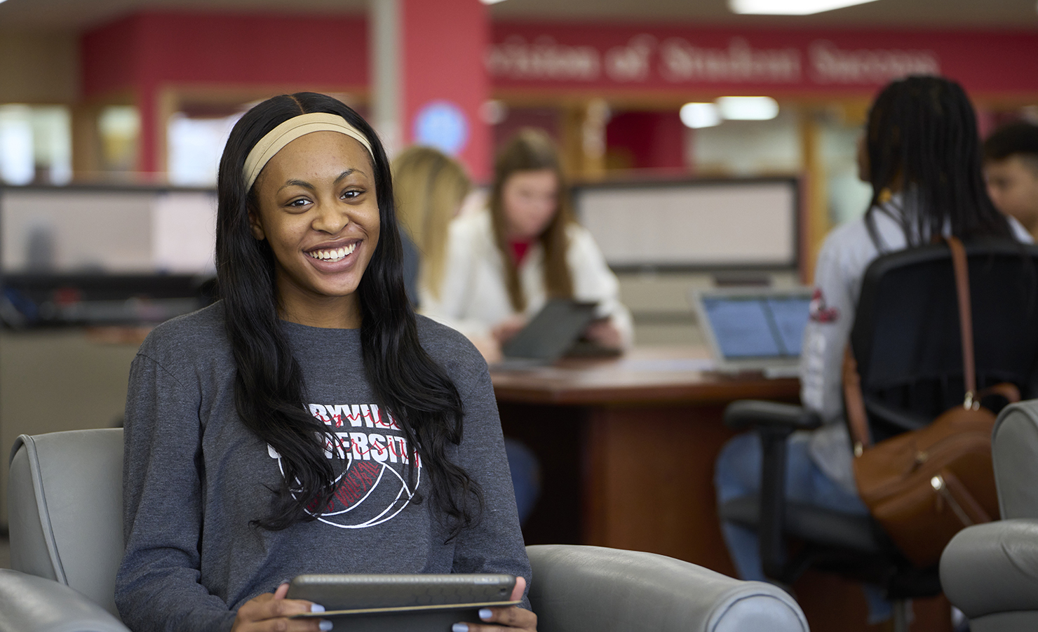 student sitting in the library