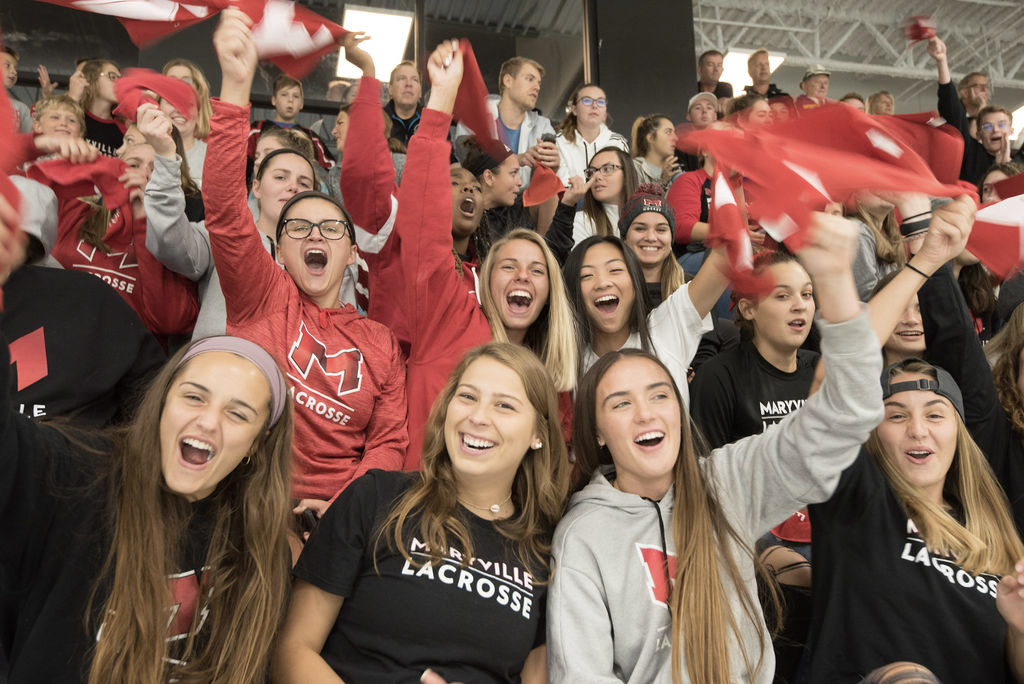 Cheering students at a Maryville University Homecoming Hockey game.