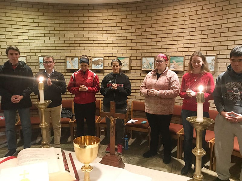 Father Waldman holding discussion at Huttig Chapel