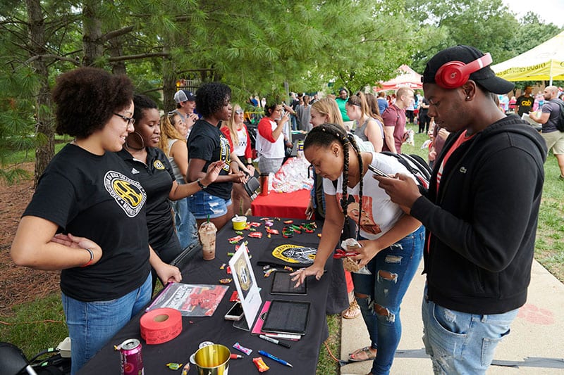 ABC students showing other students information during involvement fair