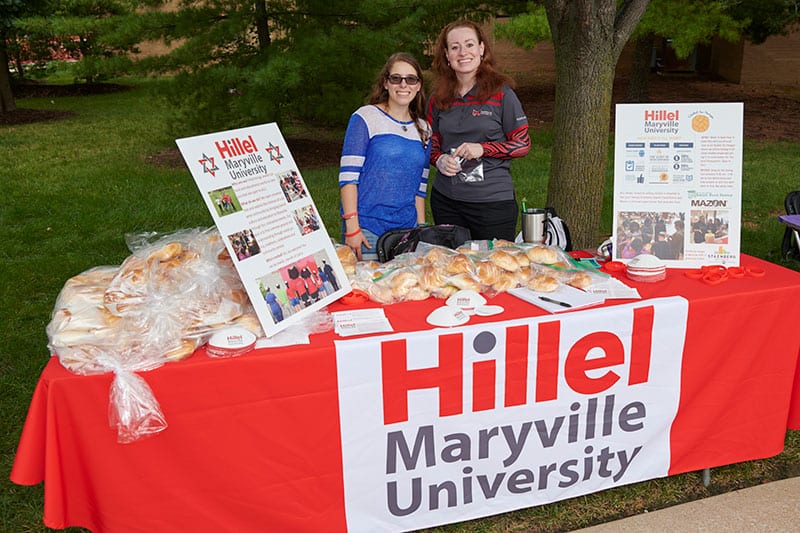 Hillel student at involvement fair