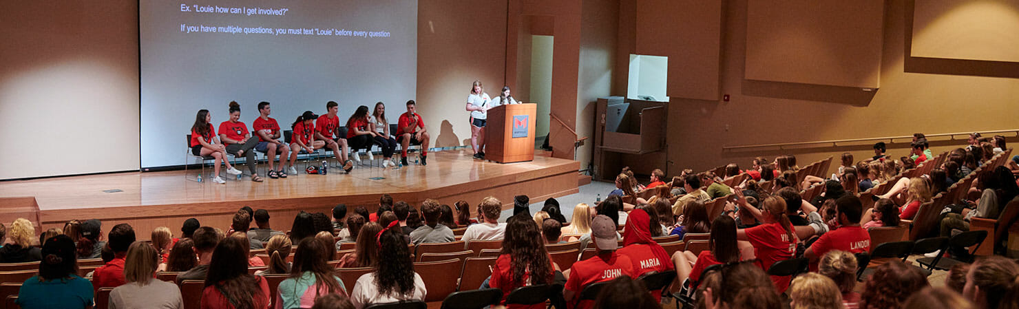 freshmen students at a seminar in the auditorium