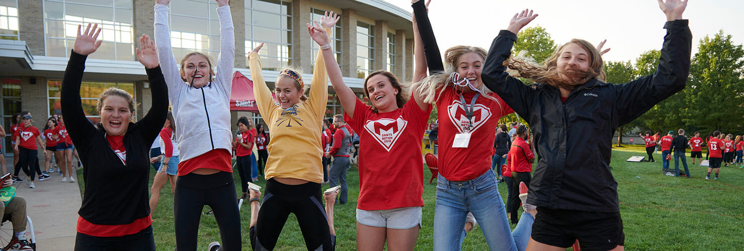 students jumping up in the air