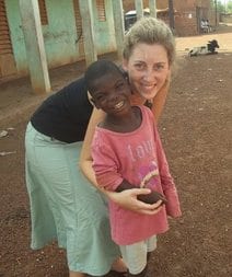 Kelsey Graczak posing for a picture with a child