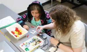 Maryville University faculty teaches students in summer robotics class.