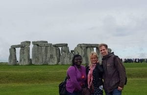 Study abroad students posing in front of Stonehenge