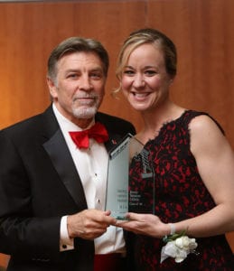 Jenny Bristow accepting a Spirit of Maryville award from Tom Eschen