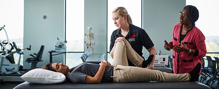 student working in physical therapy lab