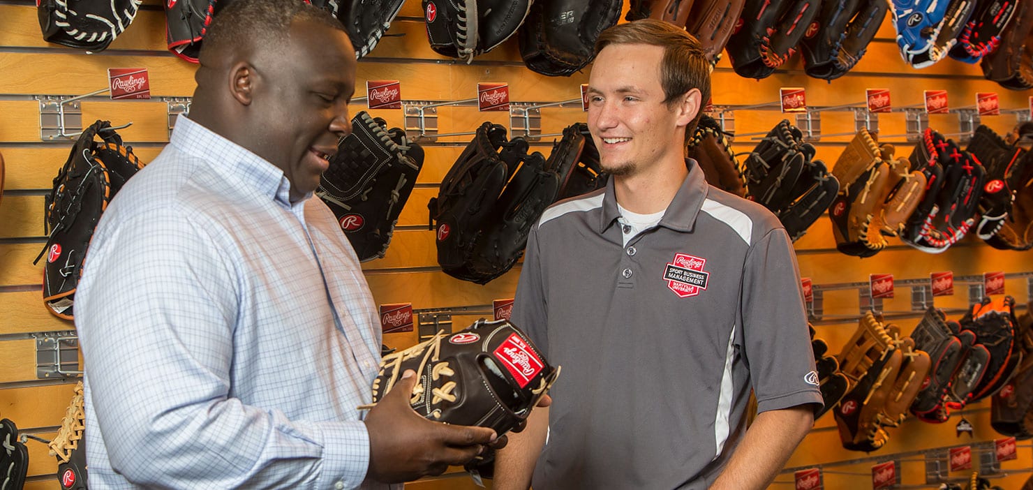 student in Rawlings showroom with jason williams