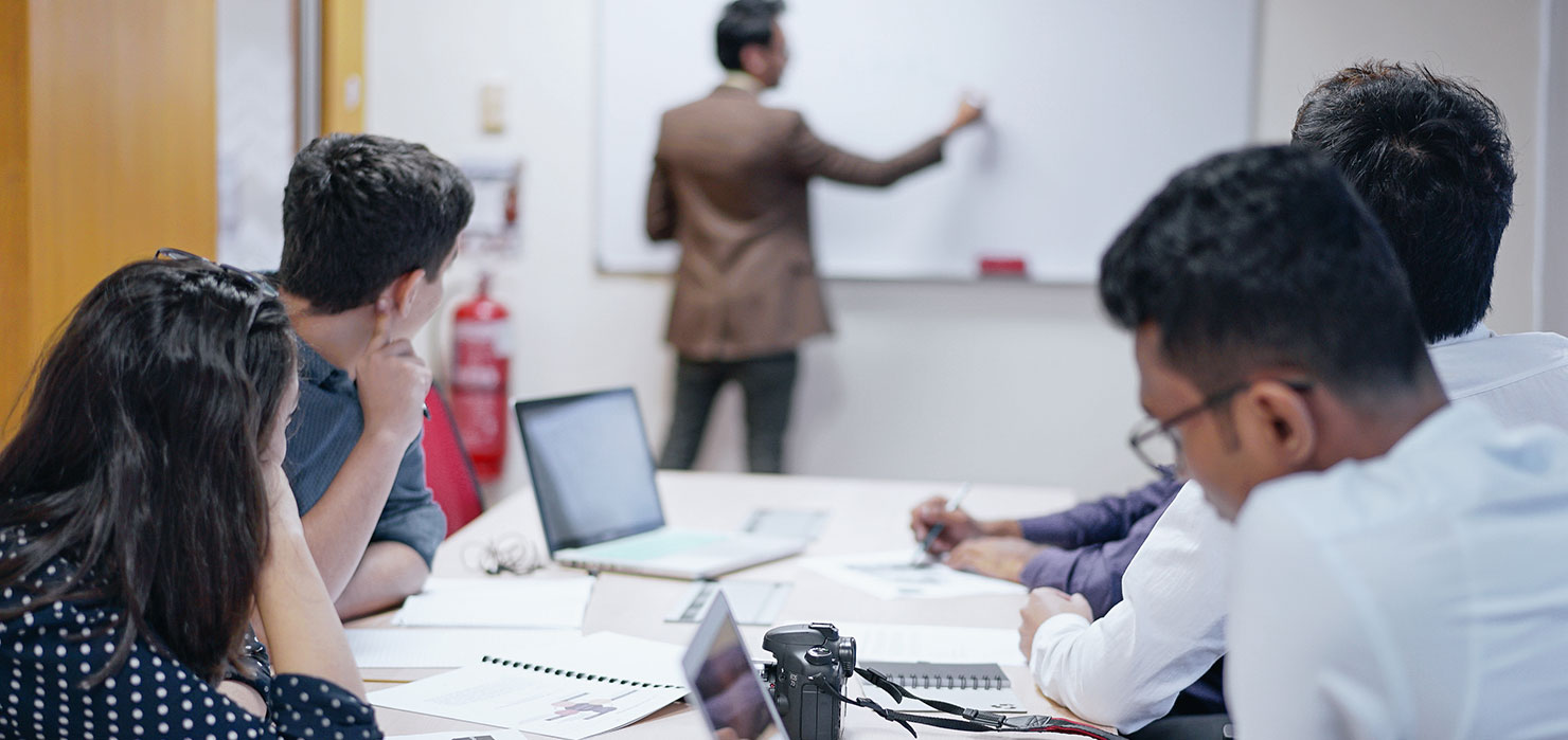 professor in class teaching students