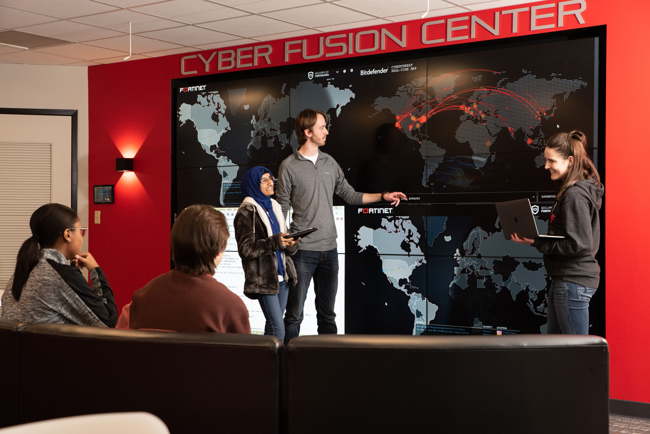 cyber security students taking a class in cyber fusion center