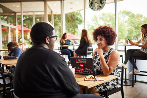 Life coach and student in Starbucks