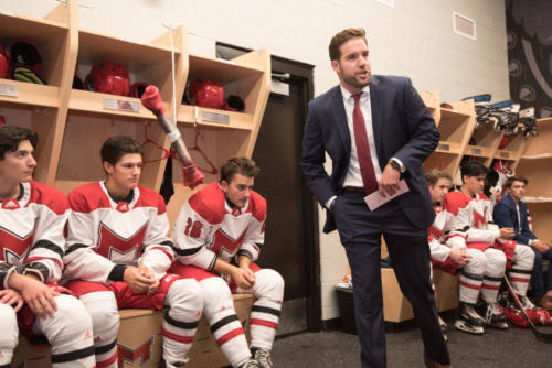 Maryville's ice hockey coach giving speech to players before game